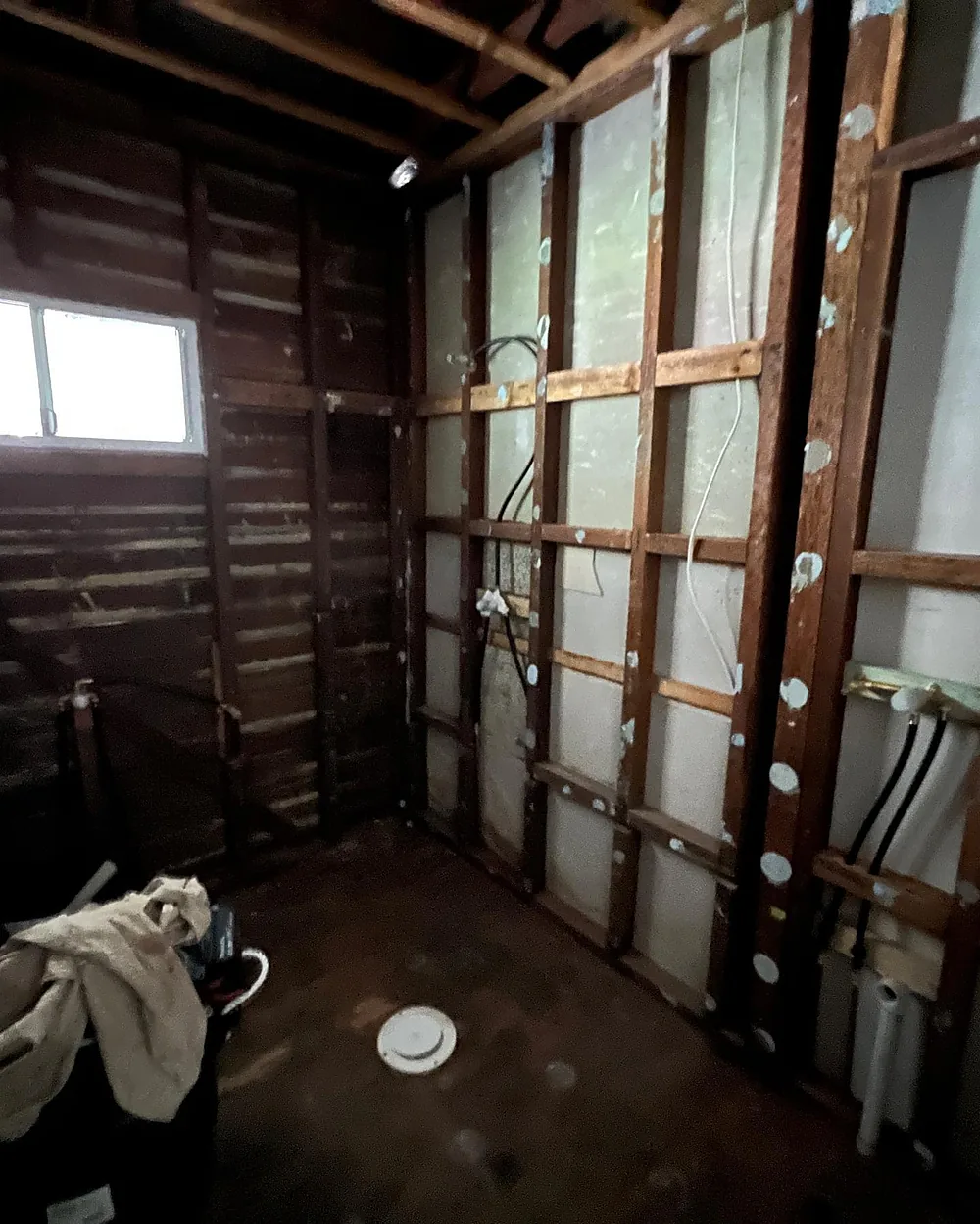 Bathroom stripped back to the stud frame with new rough-in pipework for the shower and vanity